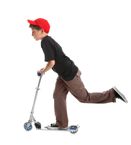 young boy on scooter red hat